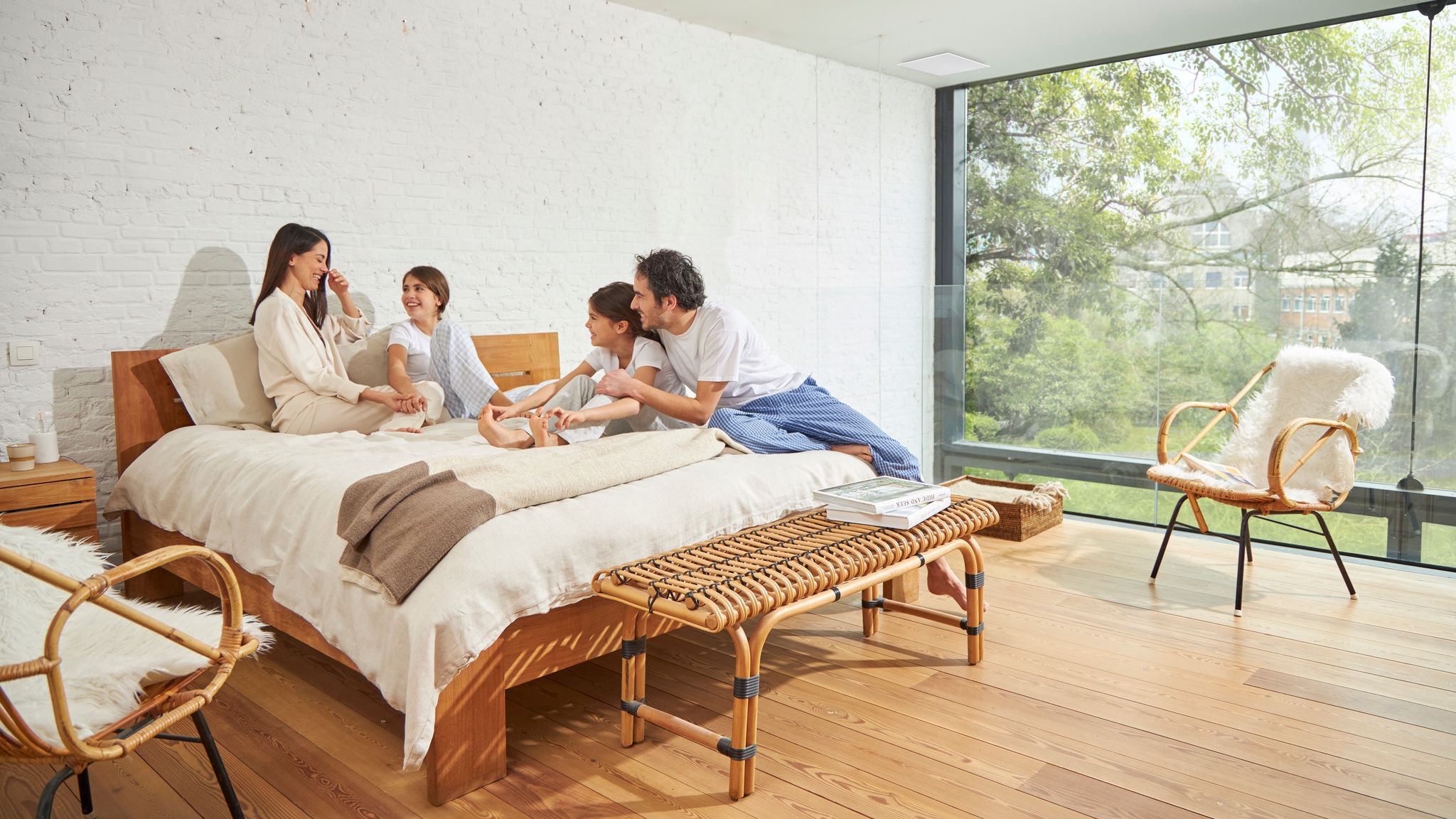 Family of four enjoying a well-ventilated bedroom