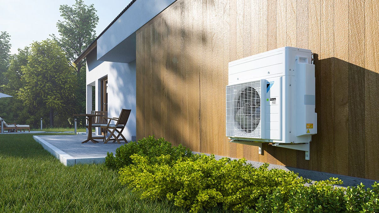 Outdoor unit of the hybrid heat pump, nicely integrated in the garden