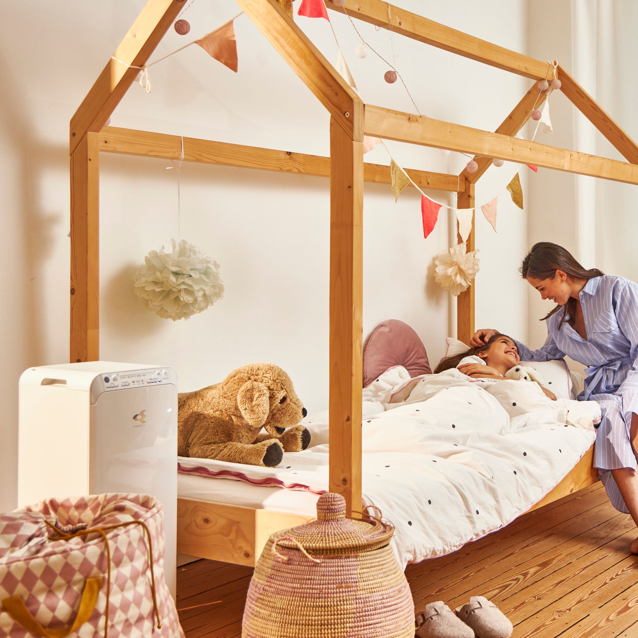 Mother putting daughter to bed in clean, pure, and healthy air