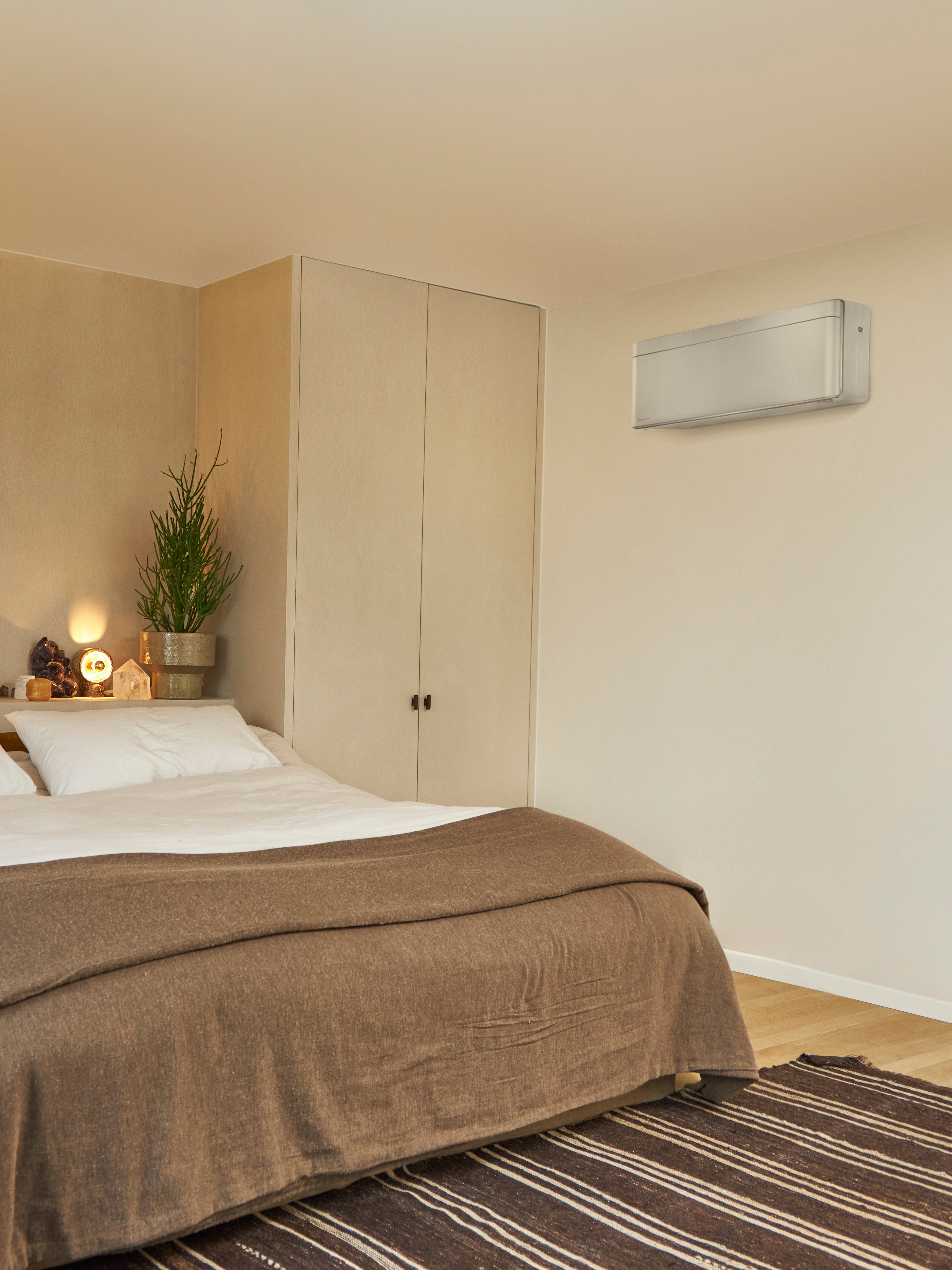 Beautifully decorated living room with plants and an air-to-air heat pump