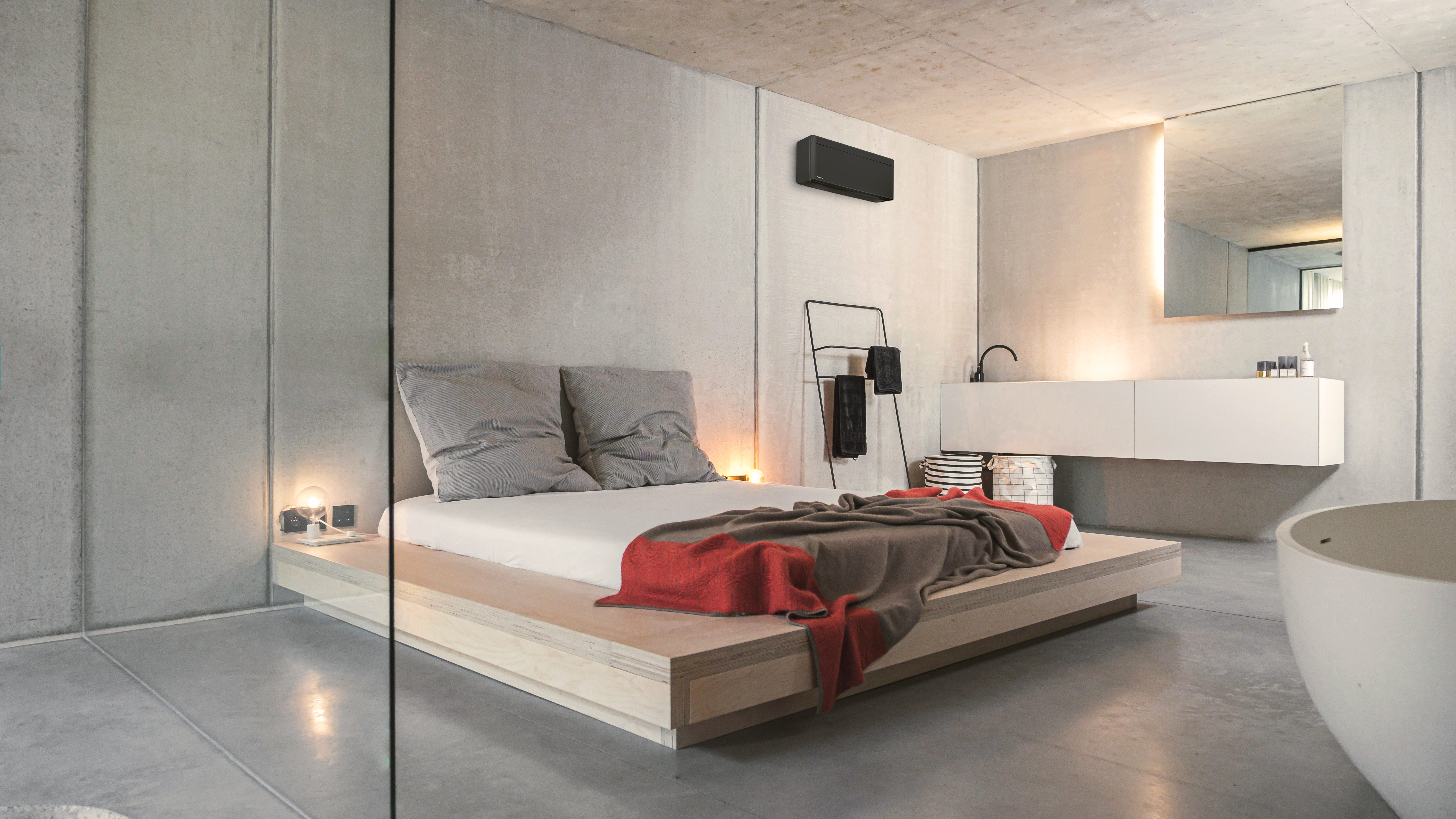 Installer putting an air-to-air heat pump on the wall